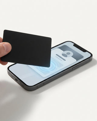 Custom NFC digital business card tapping to share a contact on a smartphone